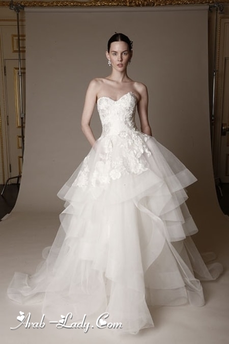 تألقي بموضة فستان الزفاف متعدد الطبقات لأناقة مثالية في ليلة العمر